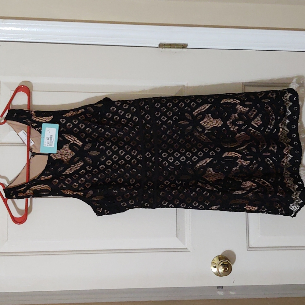 Eiffel Designs, Black lace dress with a nude underlay. Size Medium